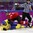 SOCHI, RUSSIA - FEBRUARY 20: Sweden's Josefine Holmgren #9 gets tangled up with Switzerland's Alina Muller #25 during women's bronze medal action at the Sochi 2014 Olympic Winter Games. (Photo by Jeff Vinnick/HHOF-IIHF Images)

